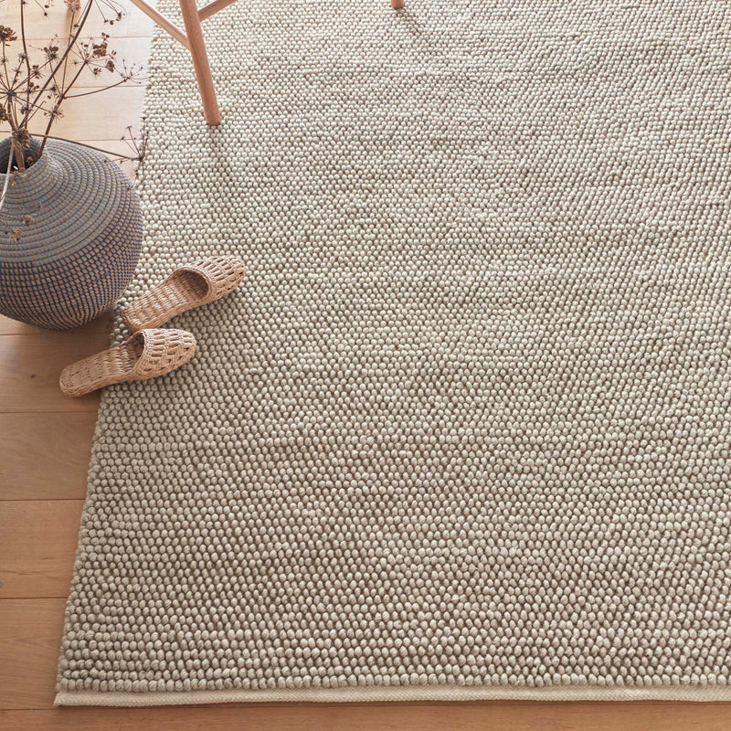 Close-up of La Playa Natural Rug with a textured design.