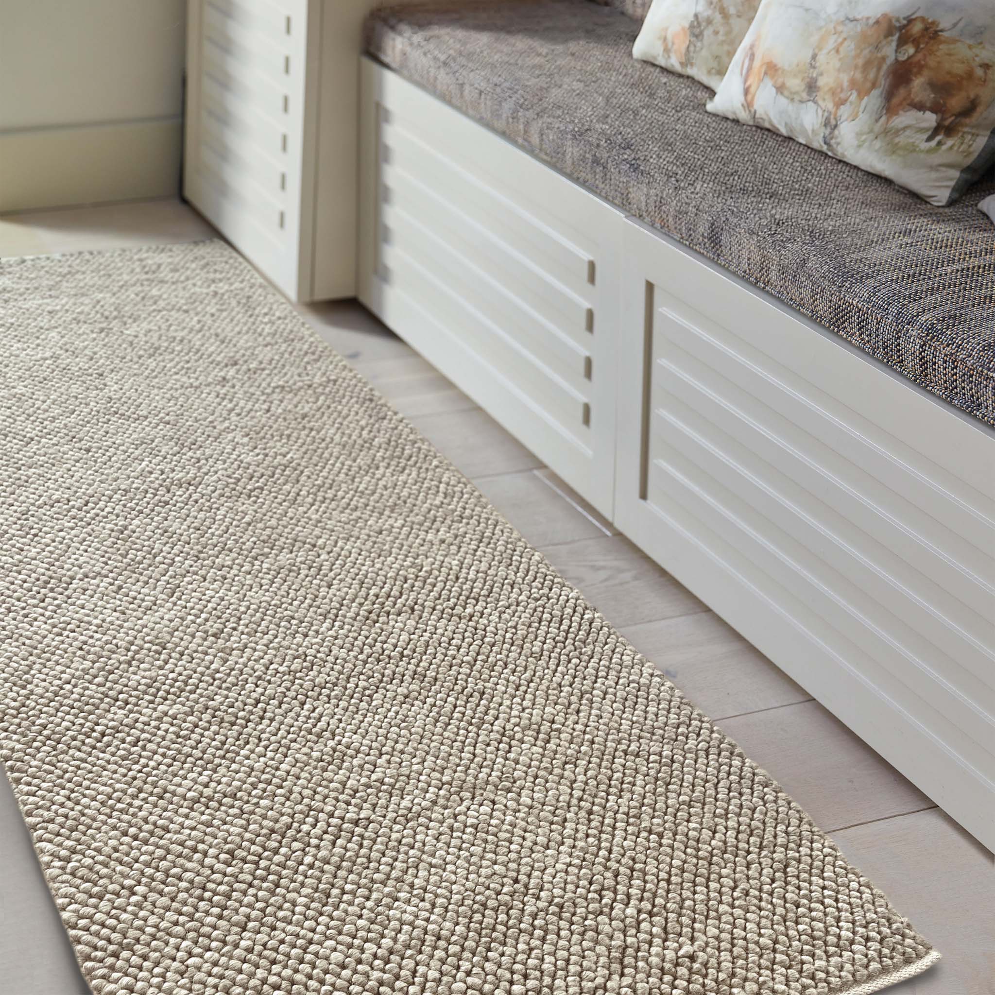 Close up of La Playa Natural Runner with a textured design, styled in an entryway.