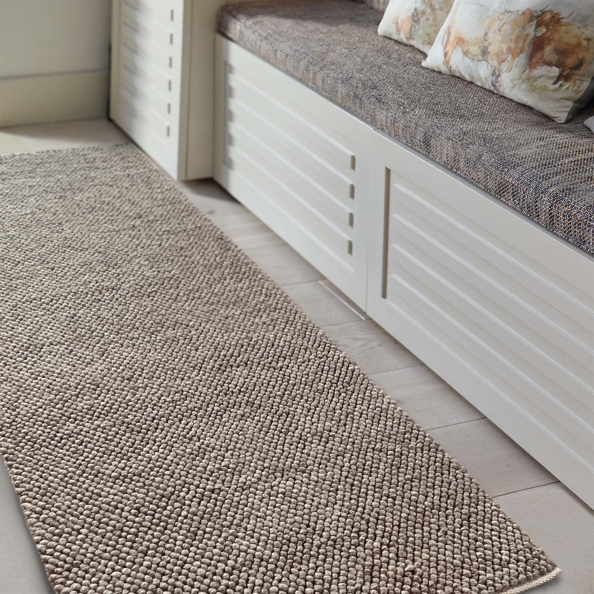 La Playa Rustic Brown Runner with a textured design, styled in a entryway.