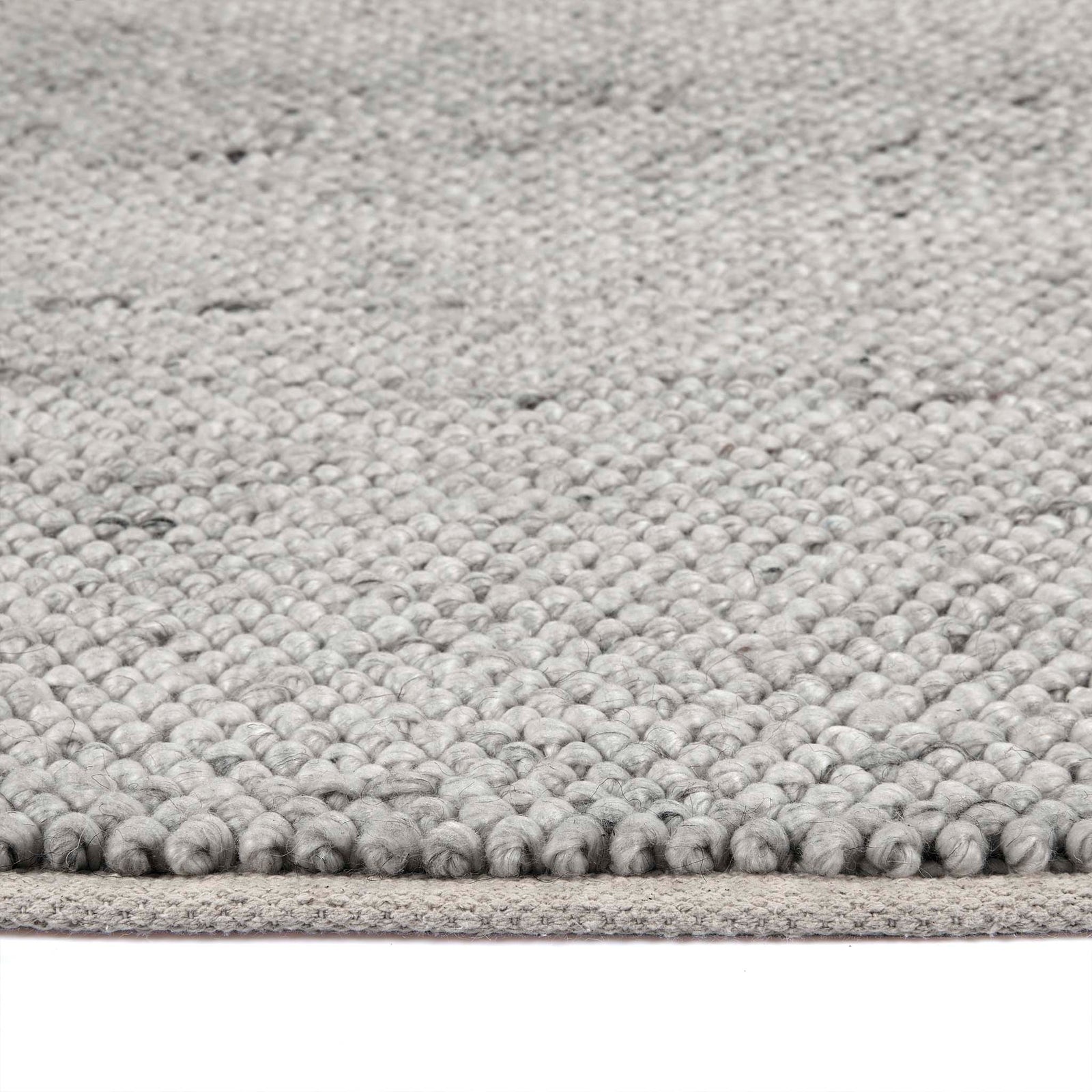 Close up of La Playa Silver Grey Rug showing pile height and its textured design.