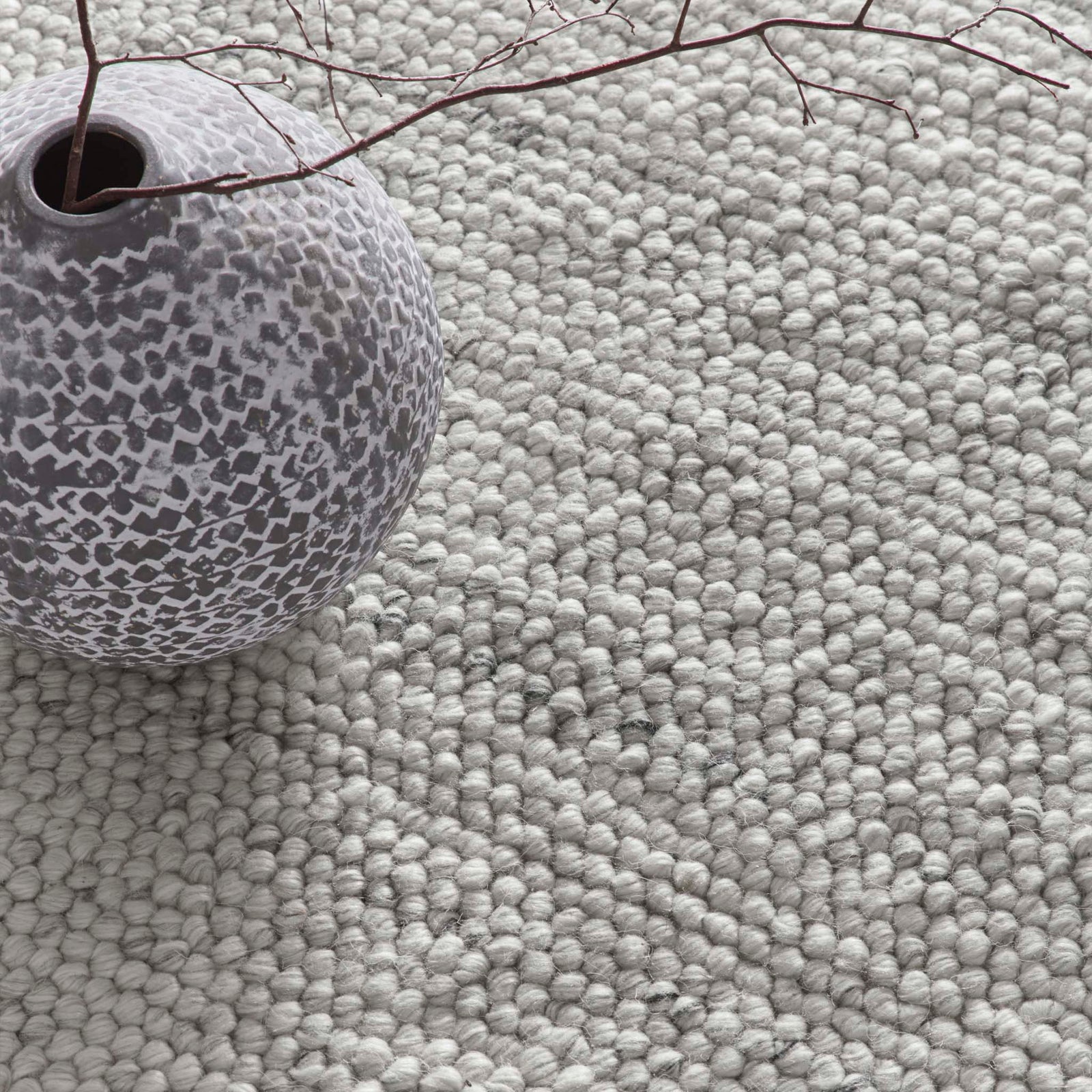 Close-up of La Playa Silver Grey Rug with a textured design.