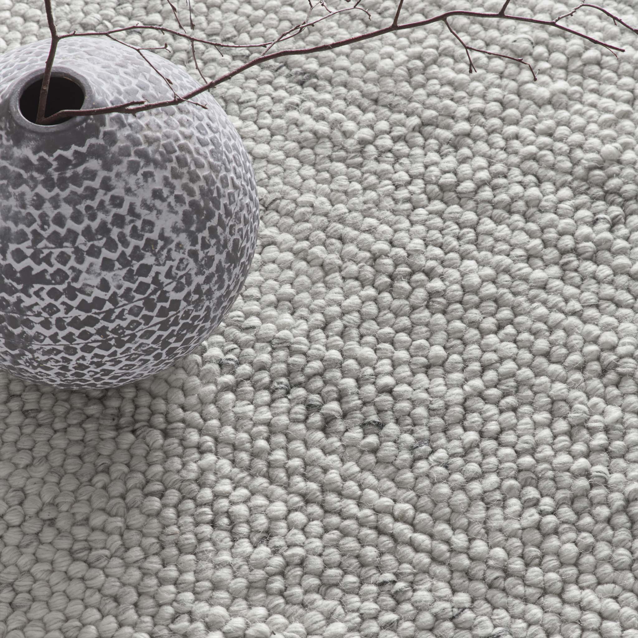 Close-up of La Playa Silver Grey Rug with a textured design.