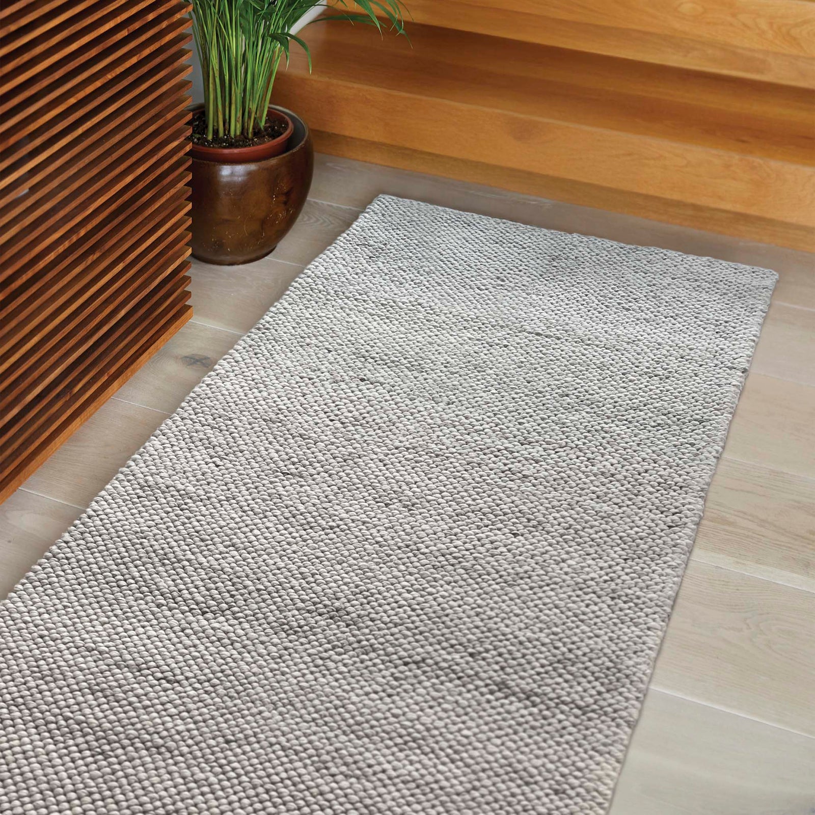 La Playa Silver Grey Runner with a textured design, styled in a entryway.