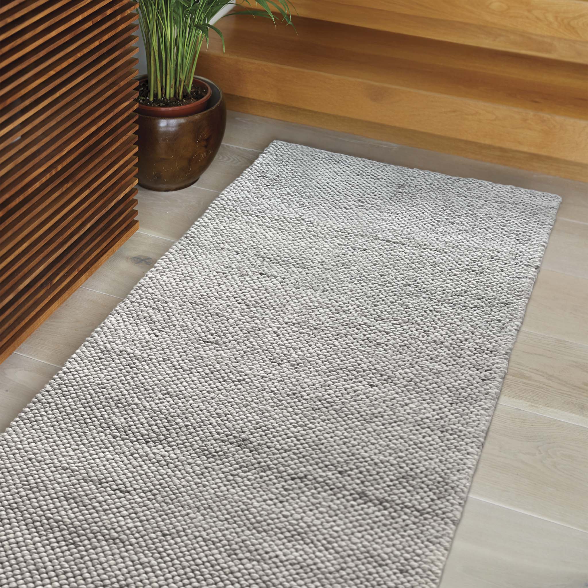La Playa Silver Grey Runner with a textured design, styled in a entryway.