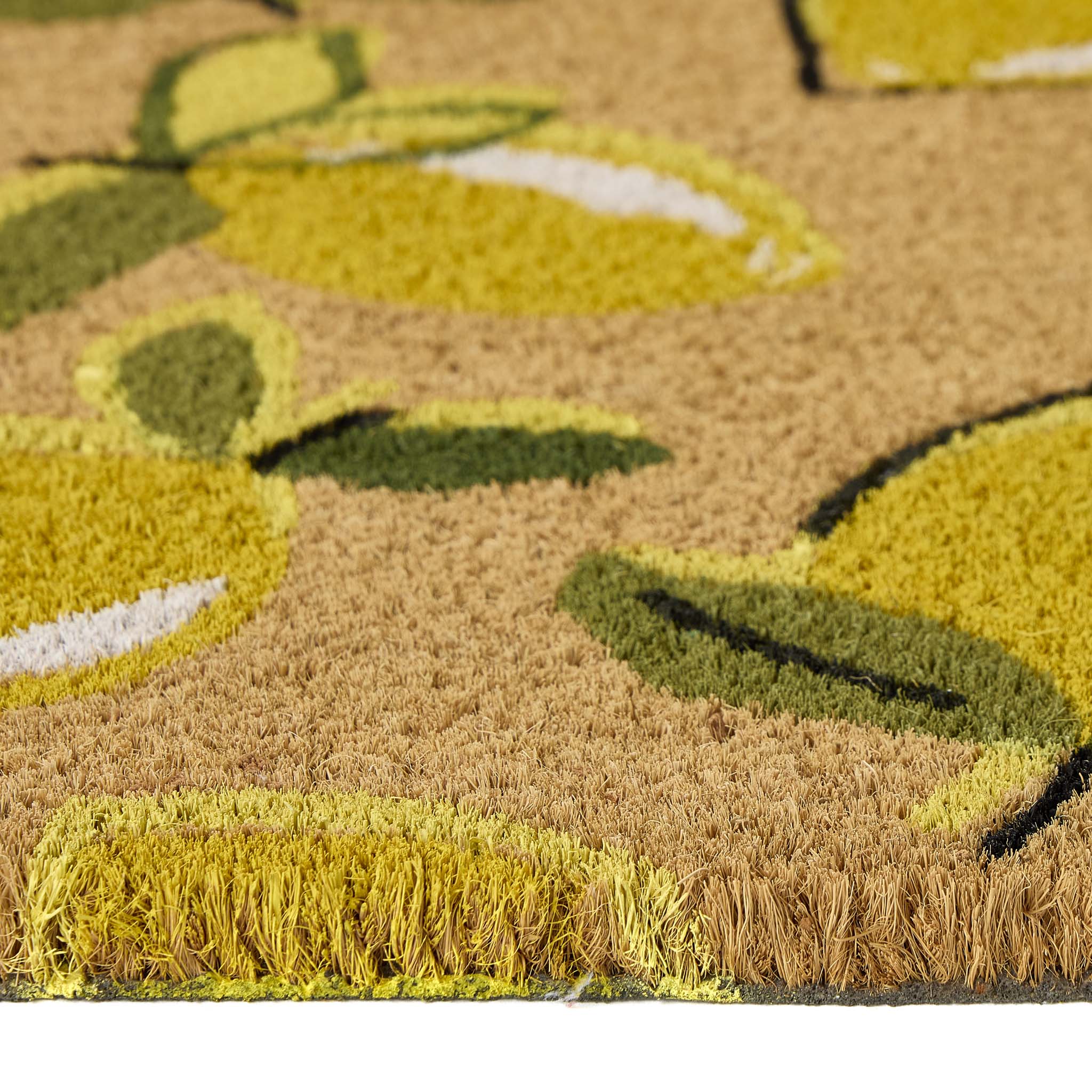 Close-Up of Lemons Coir Doormat showing pile height and yellow lemon pattern. 