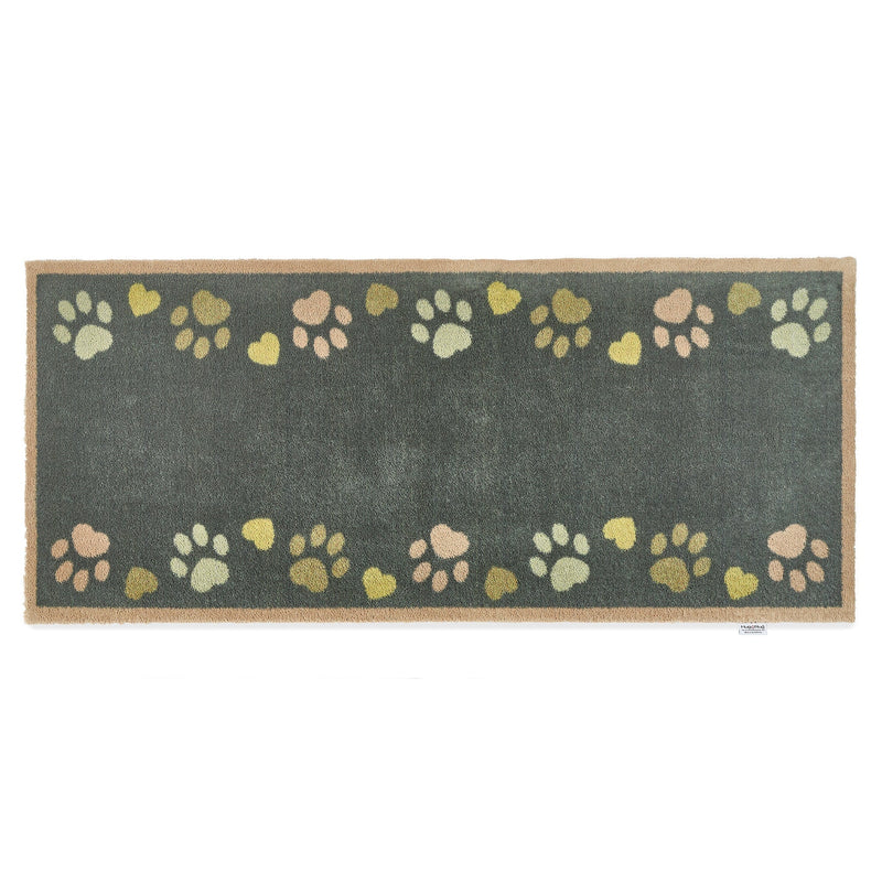 Love Paws Green Washable Runner in Green- a 100% recycled cotton runner featuring paw prints in shades of blue and green along the long sides of the runner. 
