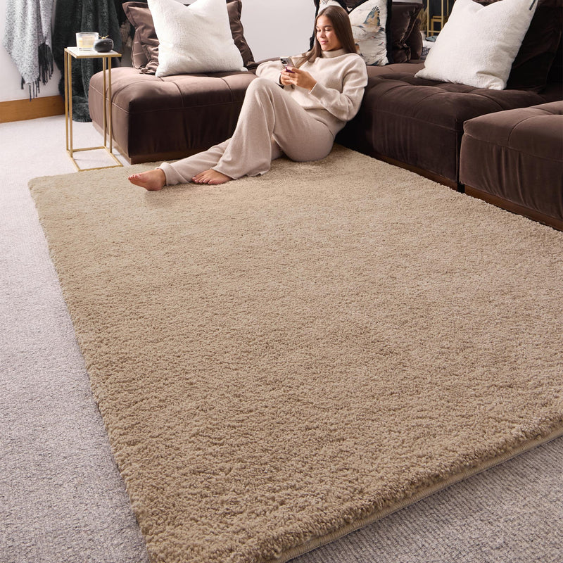 My Lux Stone Beige Washable Rug in a solid beige colour, styled in a living room.