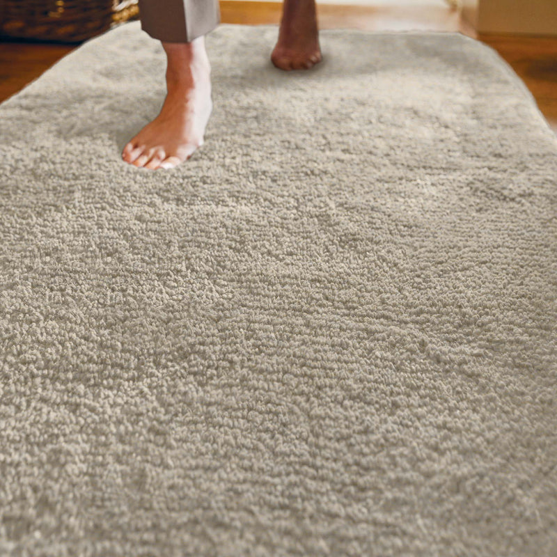 Luxe Cream Runner with a shaggy pile in cream, styled on wooden flooring. 