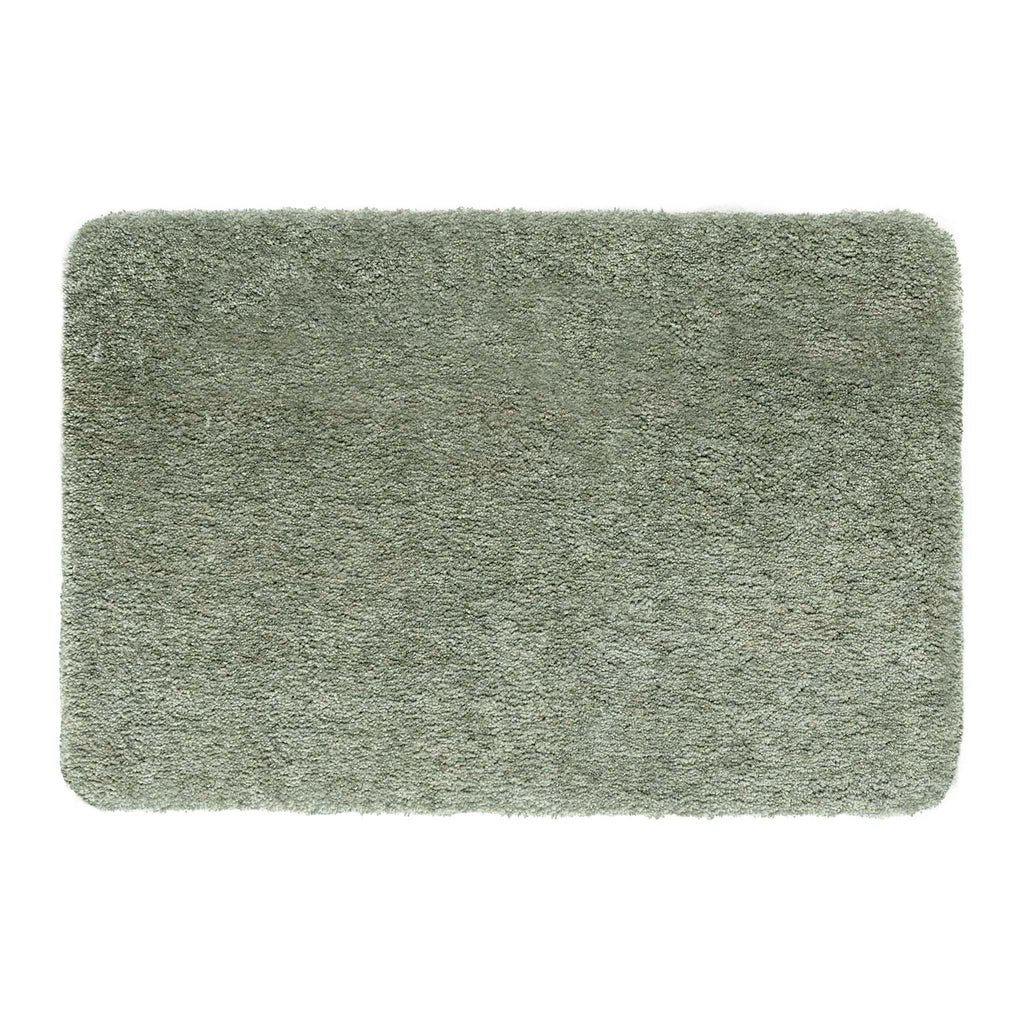 Luxe Green Rug with a shaggy pile in green.