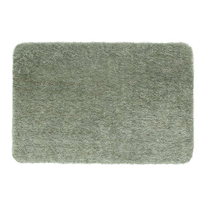 Luxe Green Rug with a shaggy pile in green.