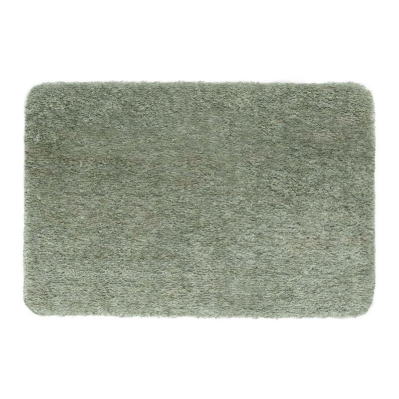 Luxe Green Rug with a shaggy pile in green.