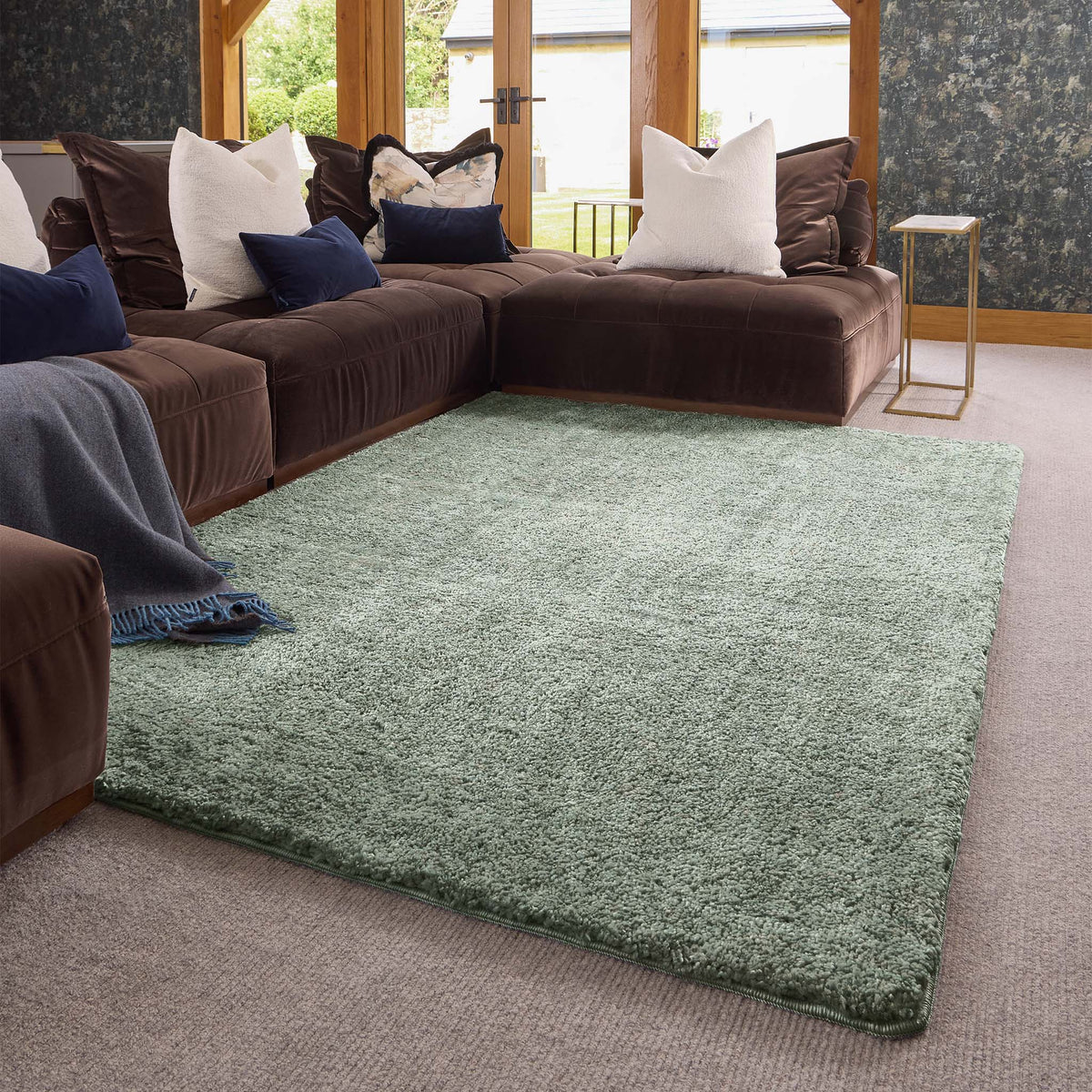 Luxe Green Rug with a shaggy pile in green, styled in a living room.