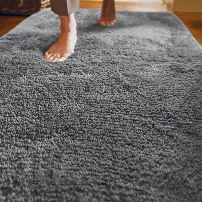 Luxe Grey Runner with a shaggy grey pile, styled on wooden flooring.