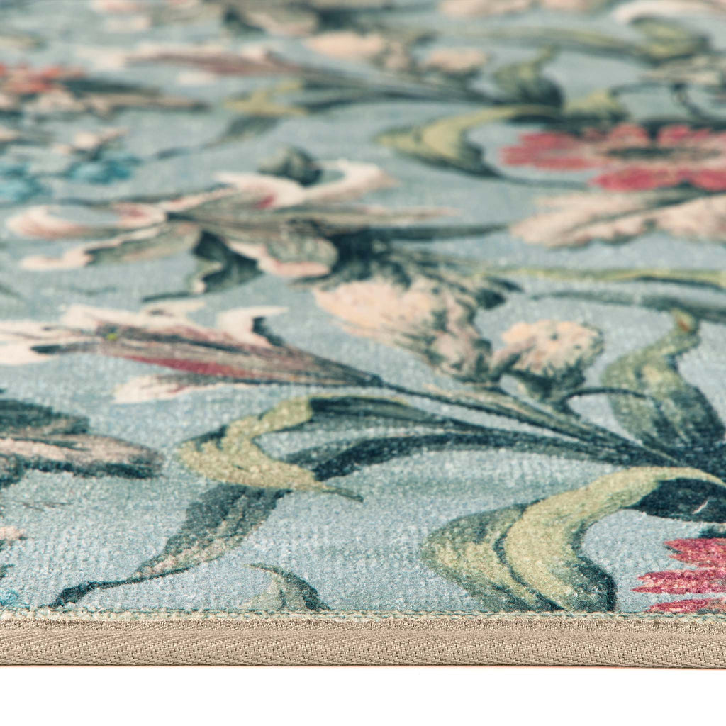 Lys Blue Eco-Washable Rug with a floral design showing the pile height. 