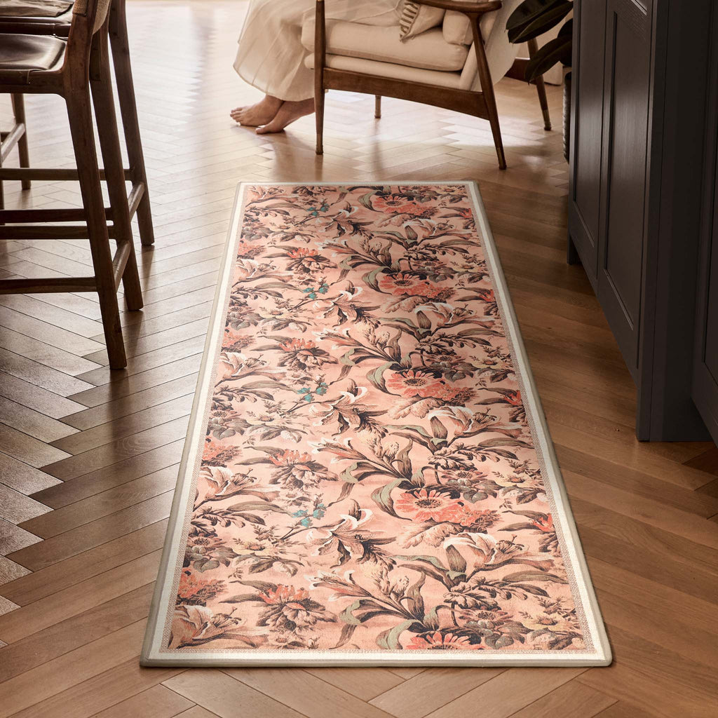 Lys Pink Eco-Washable Runner with a floral design, styled on wooden flooring. 
