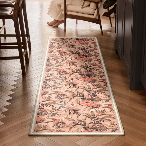Lys Pink Eco-Washable Runner with a floral design, styled on wooden flooring. 
