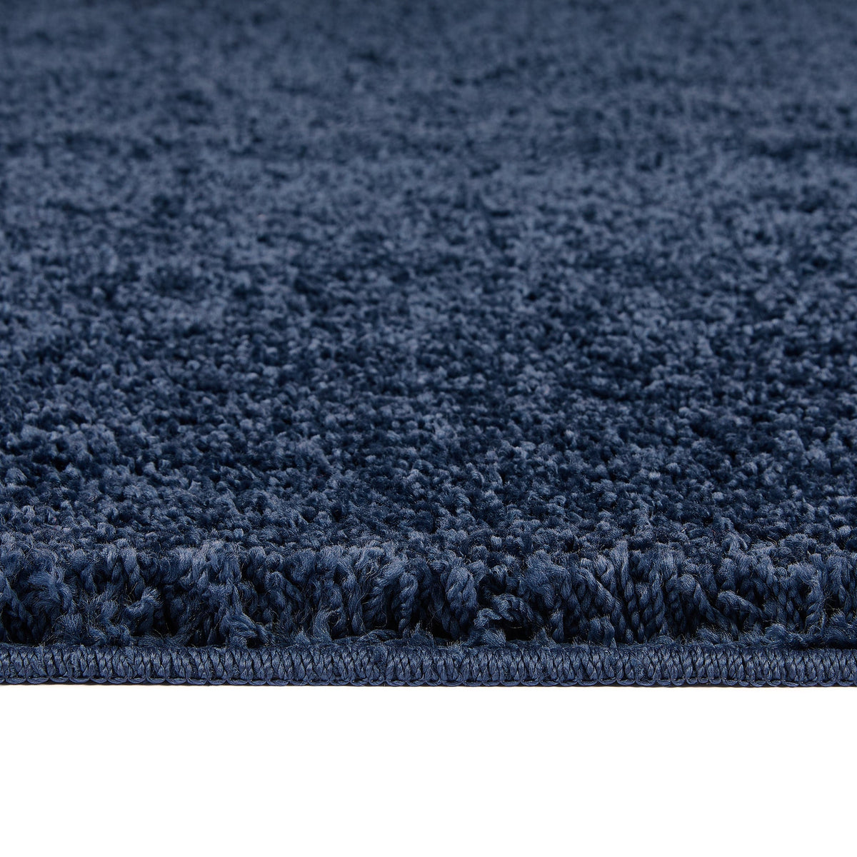 Midnight Blue Washable Rug in a solid dark blue colour, fully machine washable.