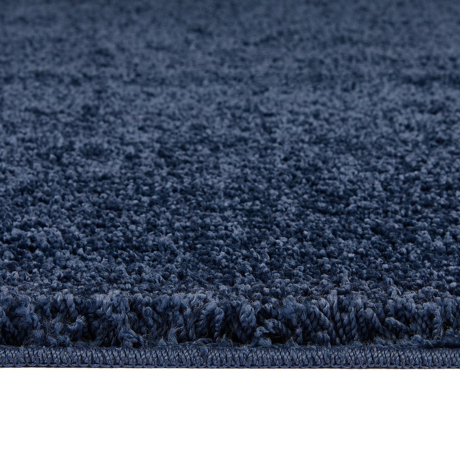 Midnight Blue Washable Rug in a solid dark blue colour, fully machine washable.