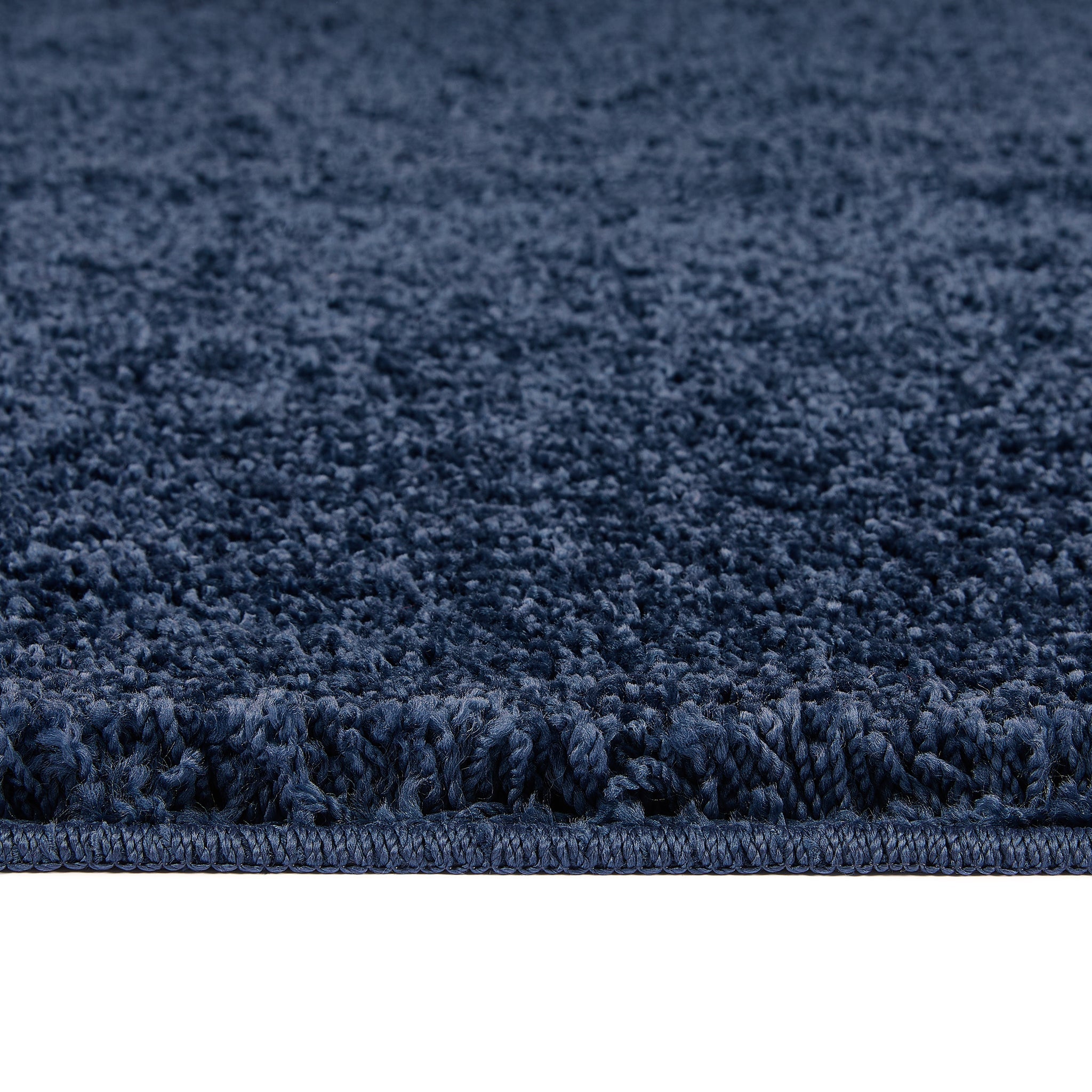 Midnight Blue Washable Rug in a solid dark blue colour, fully machine washable.
