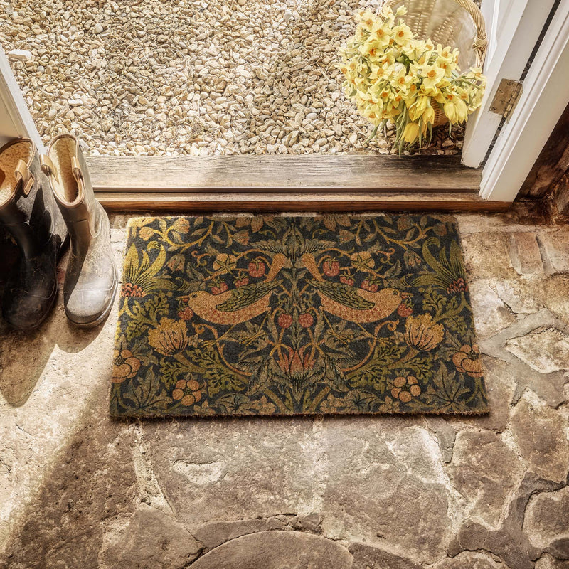Strawberry Thief Navy Coir Doormat- made from eco-friendly materials featuring birds stealing strawberries.