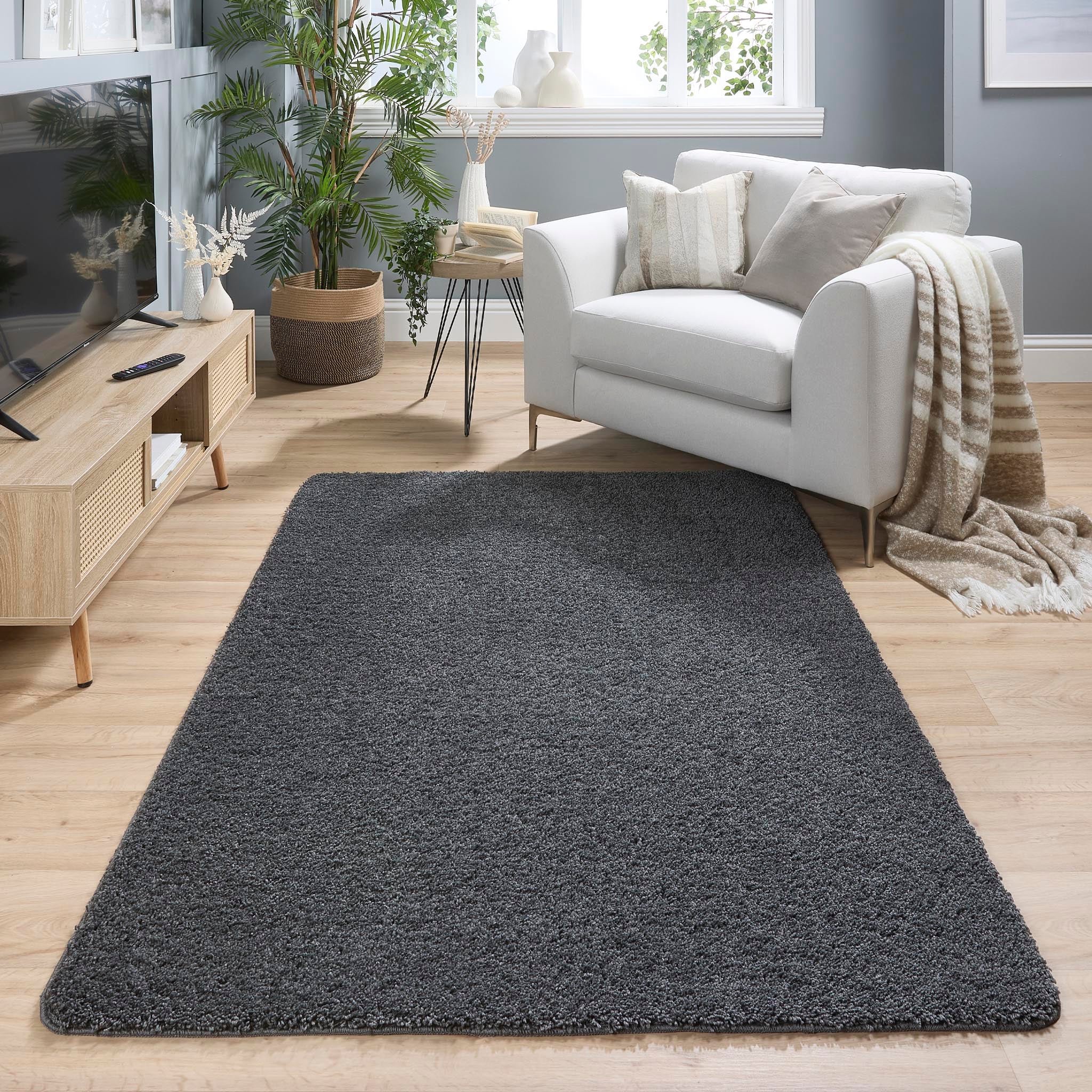 Charcoal Washable Rug in a solid dark grey colour, fully machine washable.