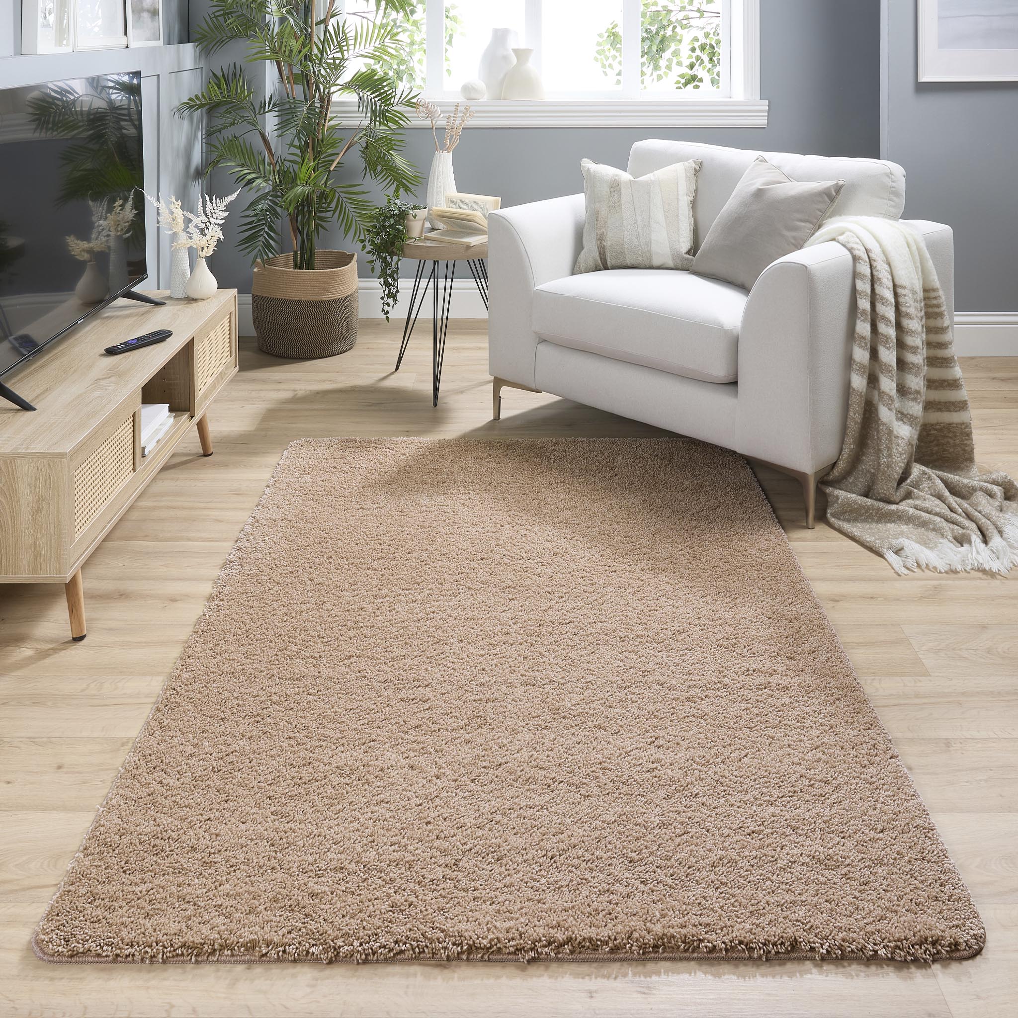 My Rug Nude Pink Washable Rug with a shaggy pile, styled in a living room.
