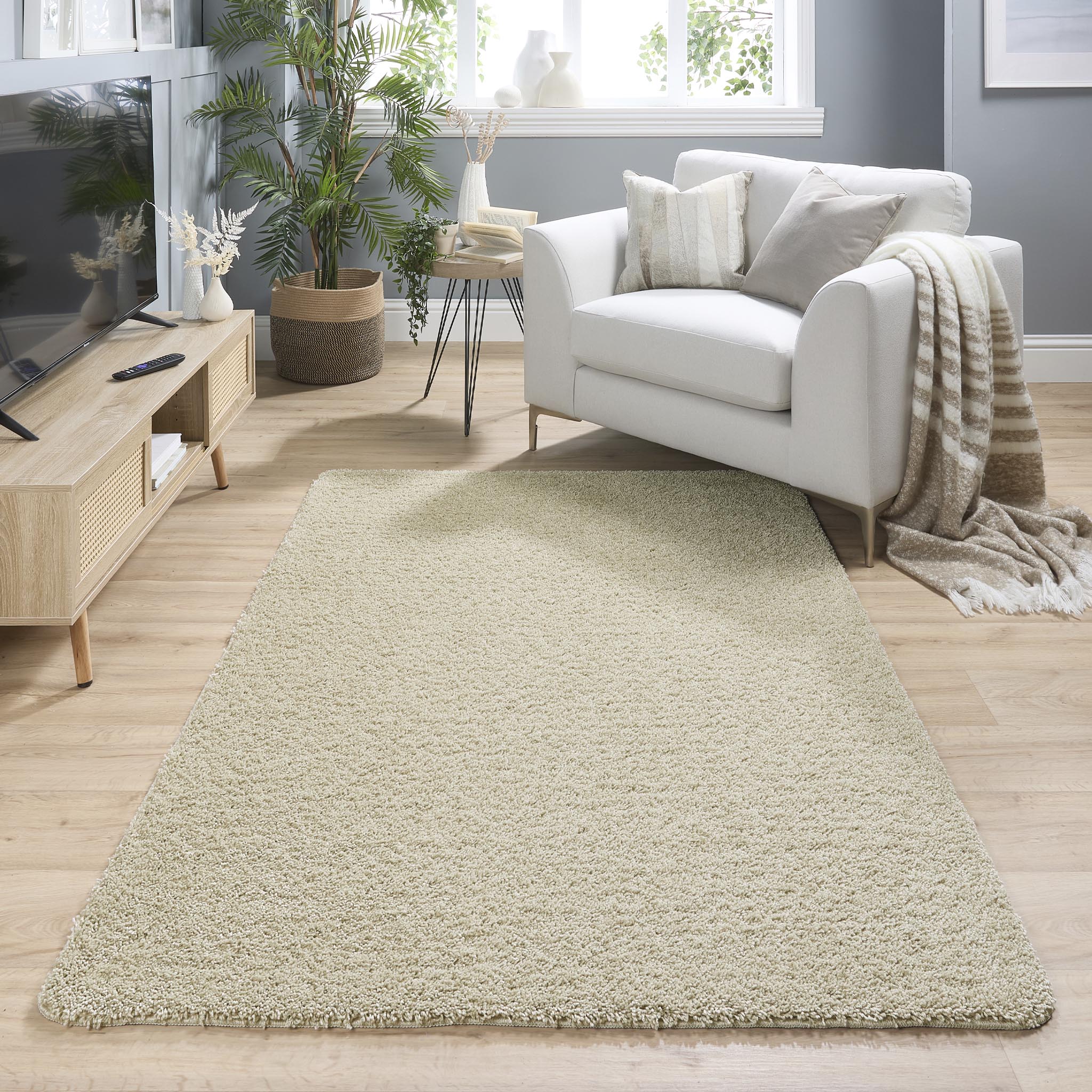 My Rug Stone Beige Washable Rug with a shaggy pile. styled in a living room.