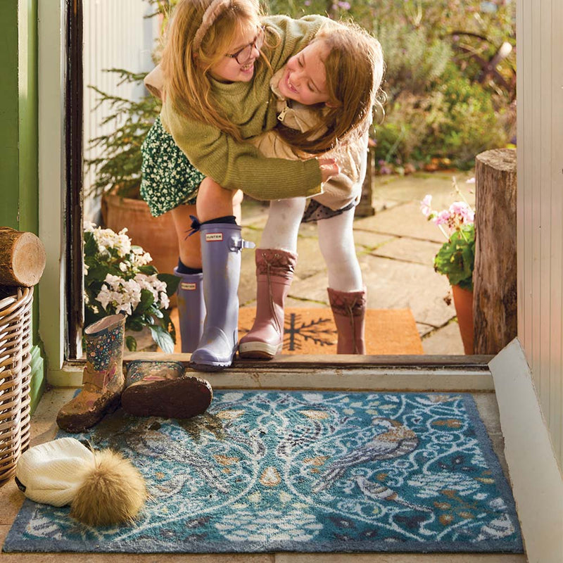 Nature 25 Washable Runner- a 100% recycled cotton runner featuring birds in off-white, beige, brown, and black among foliage.