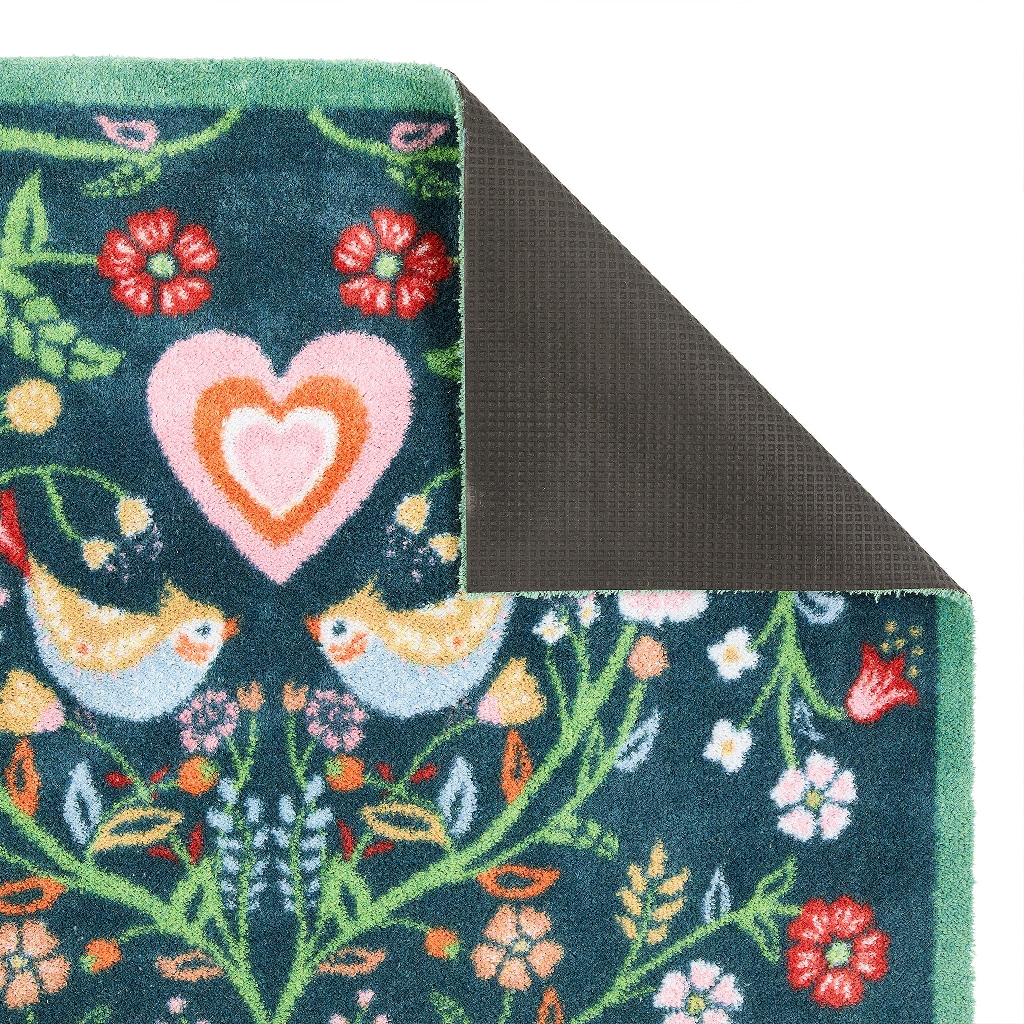 Nature 35 Love Birds Washable Runner in a dark blue- a 100% recycled cotton runner featuring a symmetrical pattern of intertwined branches adorned with colourful leaves and flowers.
