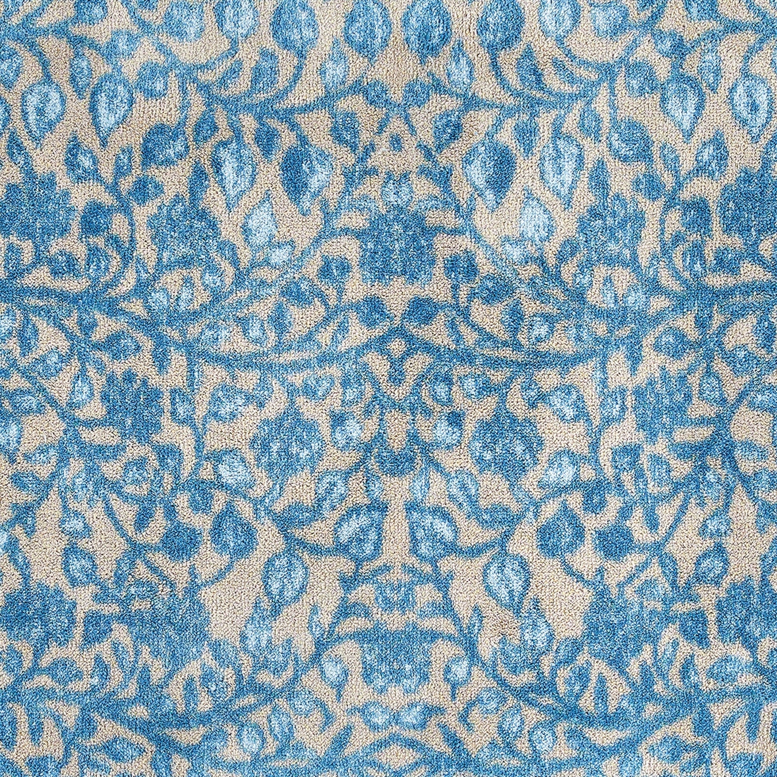 Nature 33 Washable Runner in Beige- a 100% recycled cotton runner featuring intertwining floral pattern in various shades of blue.
