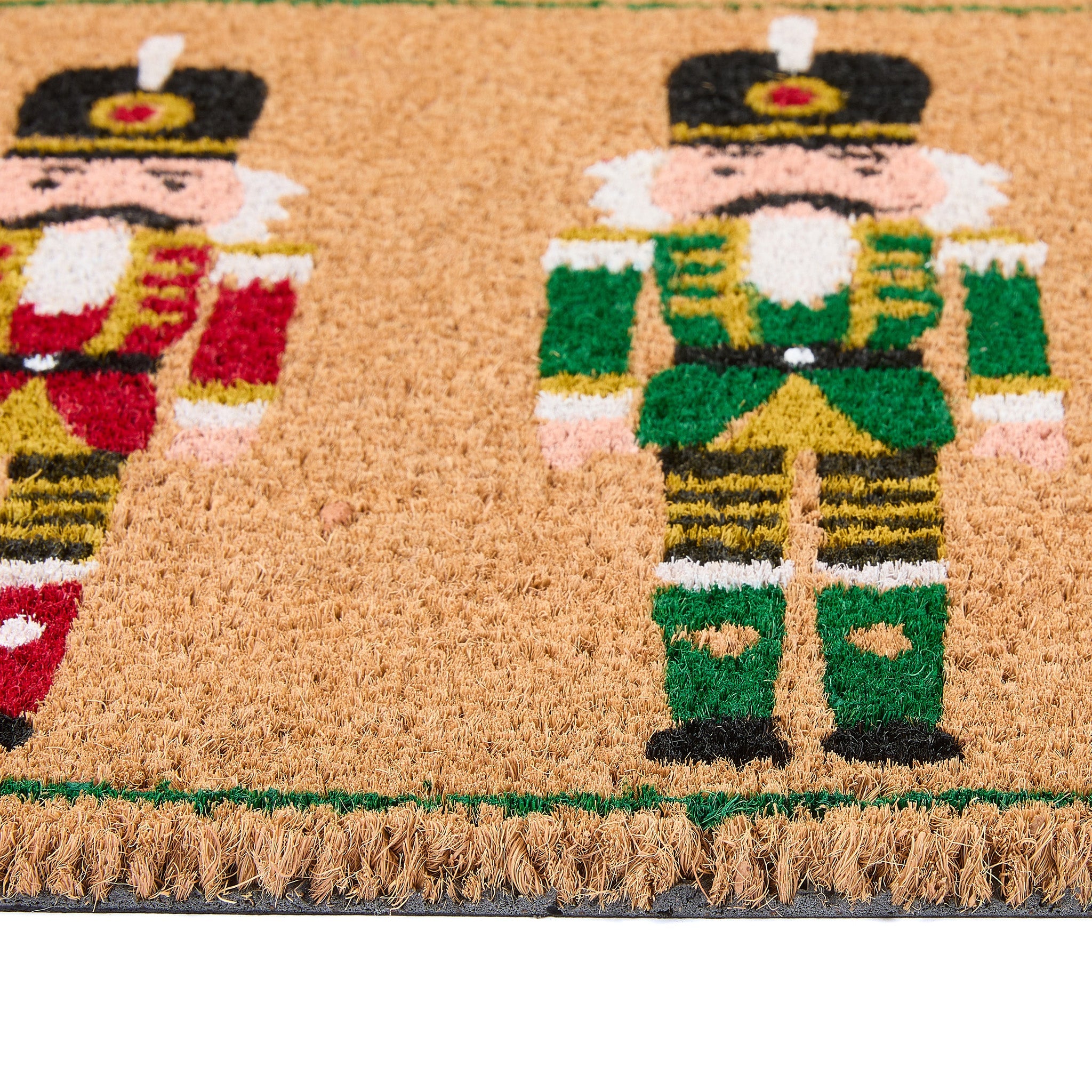 Christmas Nutcracker Coir Doormat with three colourful nutcrackers.