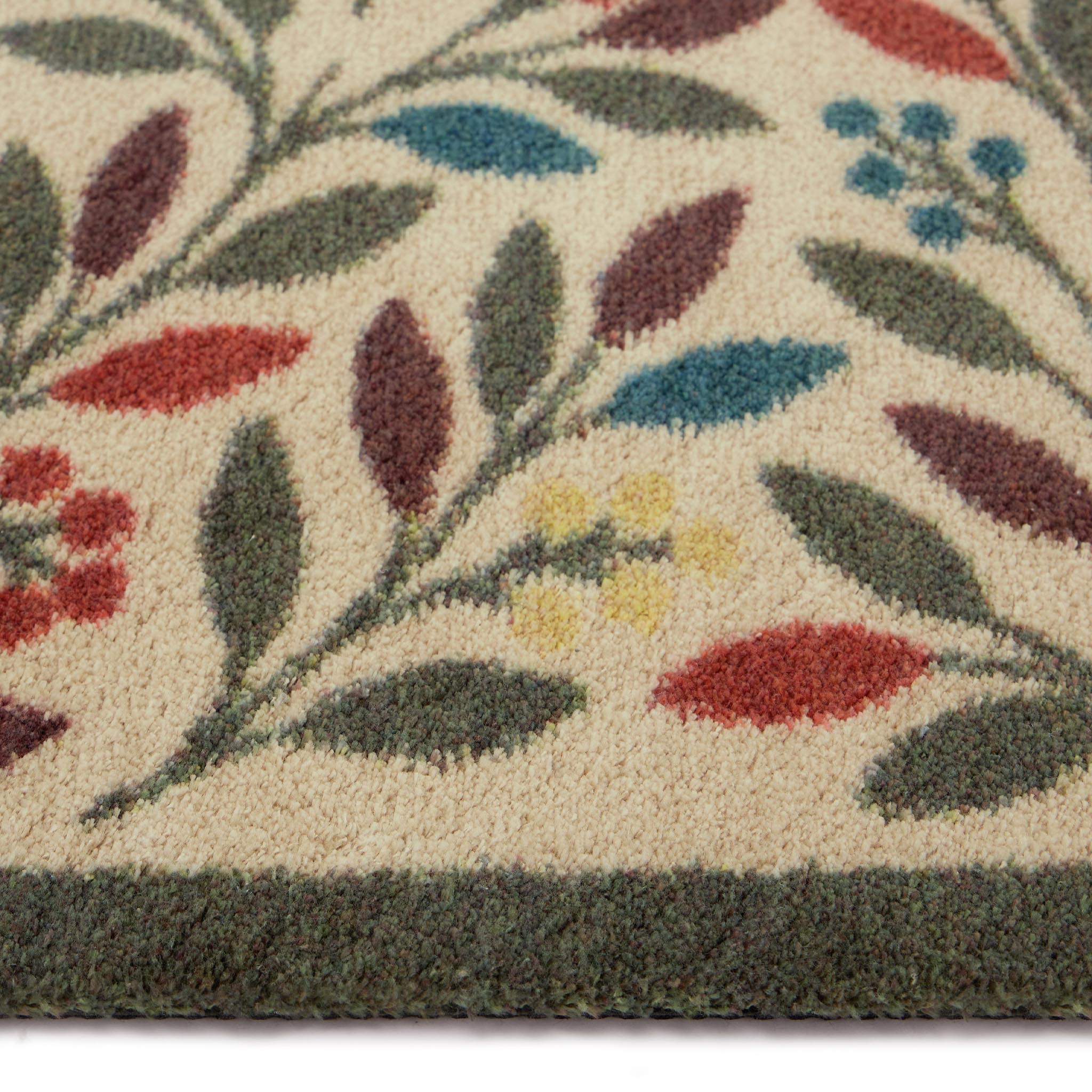  Olive Branch Washable doormat in a light brown- a 100% recycled cotton doormat featuring branches adorned with multicoloured leaves and olives.