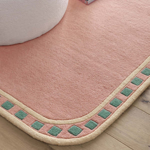 Borderline Pink Rug- 100% wool cut pile rug with a geometric patterned border. 
