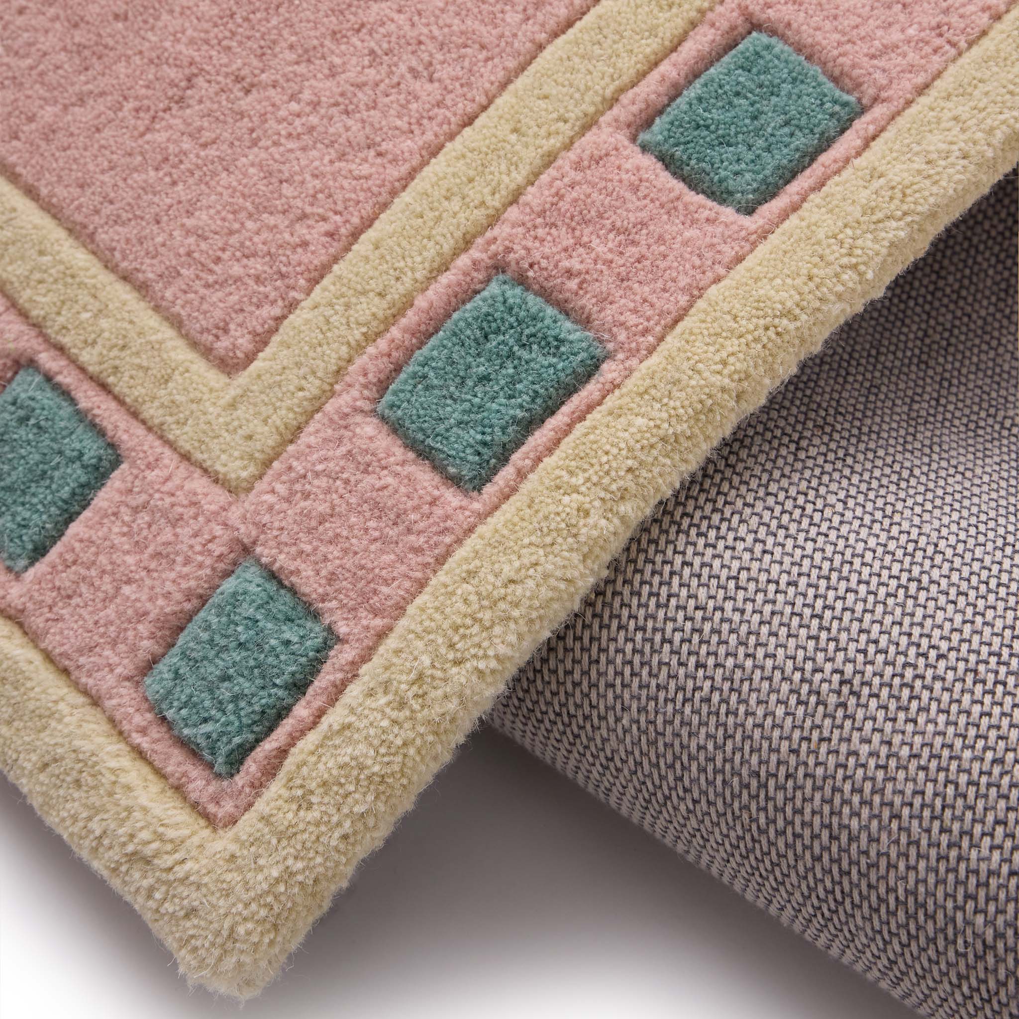 Borderline Pink Rug- 100% wool cut pile rug with a geometric patterned border. 