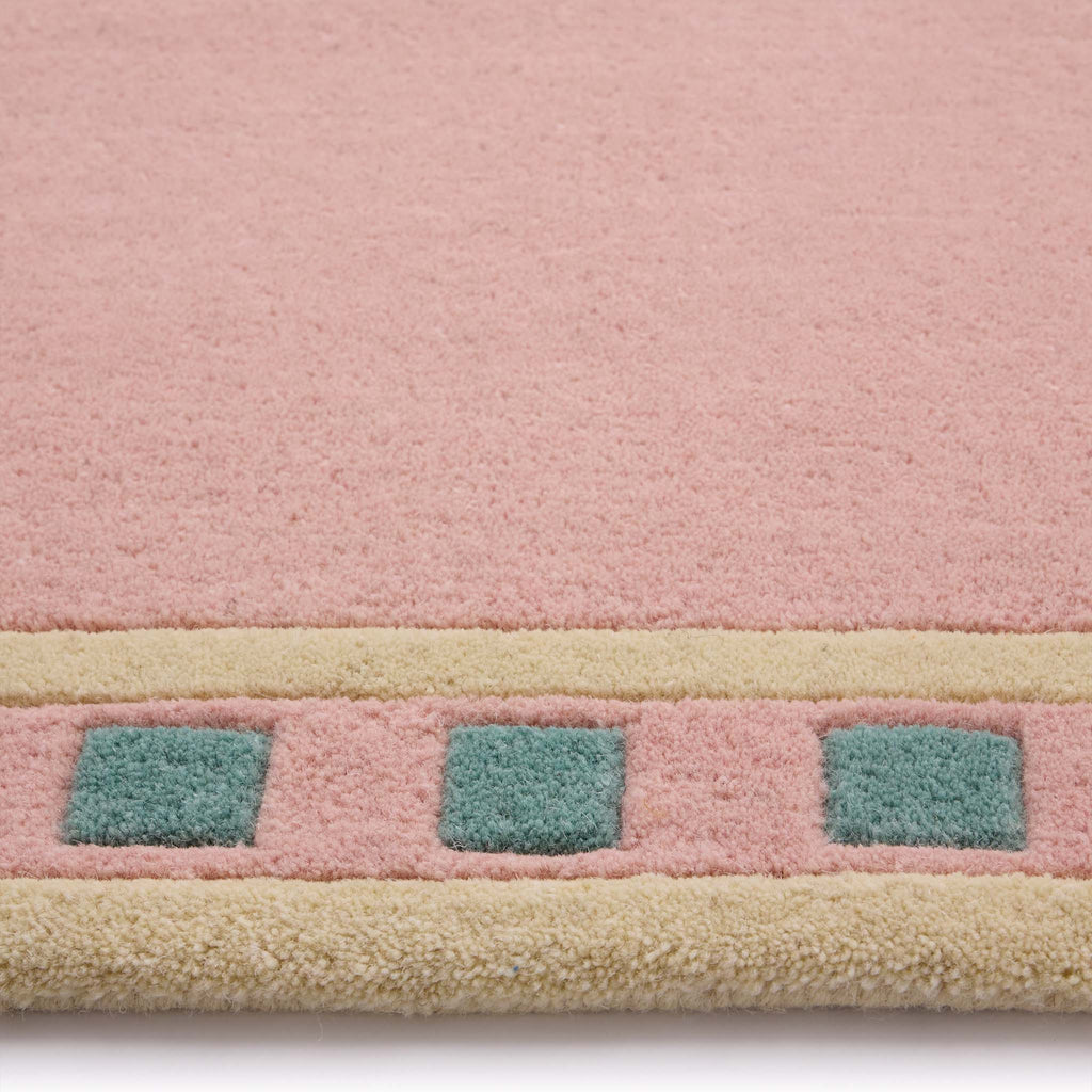 Borderline Pink Rug- 100% wool cut pile rug with a geometric patterned border. 