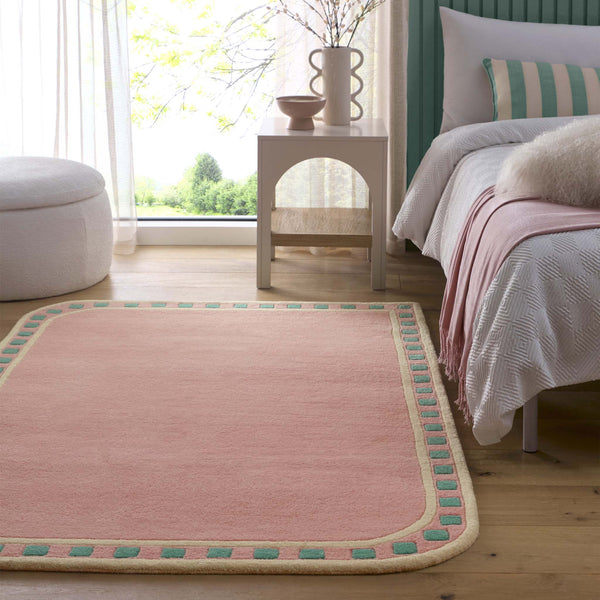 Borderline Pink Rug- 100% wool cut pile rug with a geometric patterned border. 
