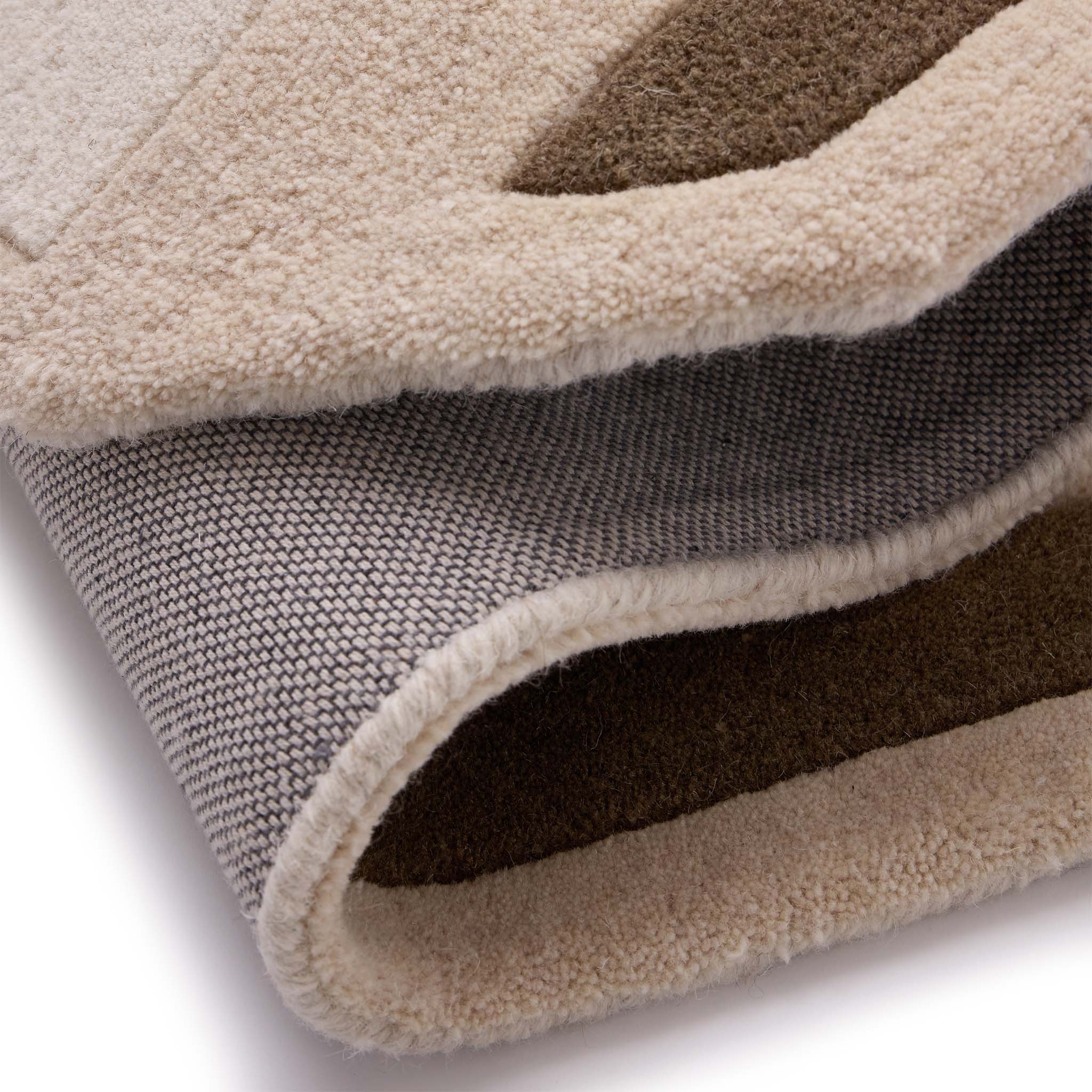 Contour Rug- a 100% wool carved rug featuring a cream and brown border.