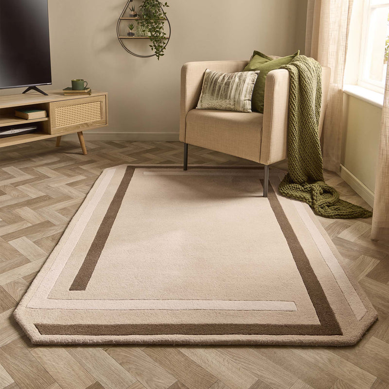 Contour Rug- a 100% wool carved rug featuring a cream and brown border.