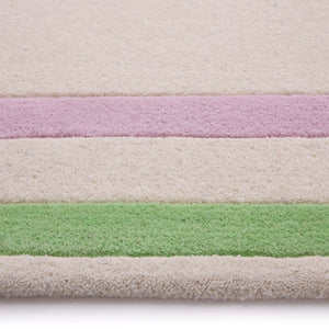 Contour Lavender Green Rug- a 100% wool carved rug featuring a lavender and green border. 
