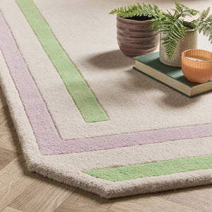 Contour Lavender Green Rug- a 100% wool carved rug featuring a lavender and green border. 
