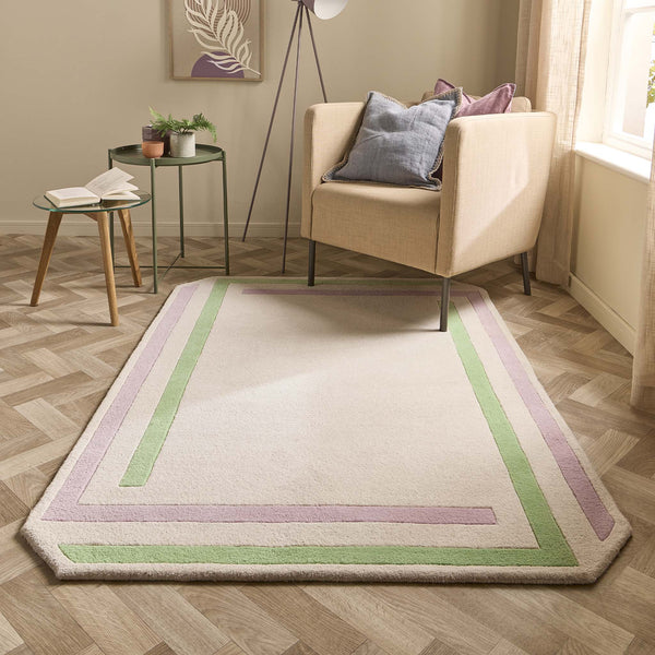 Contour Lavender Green Rug- a 100% wool carved rug featuring a lavender and green border. 