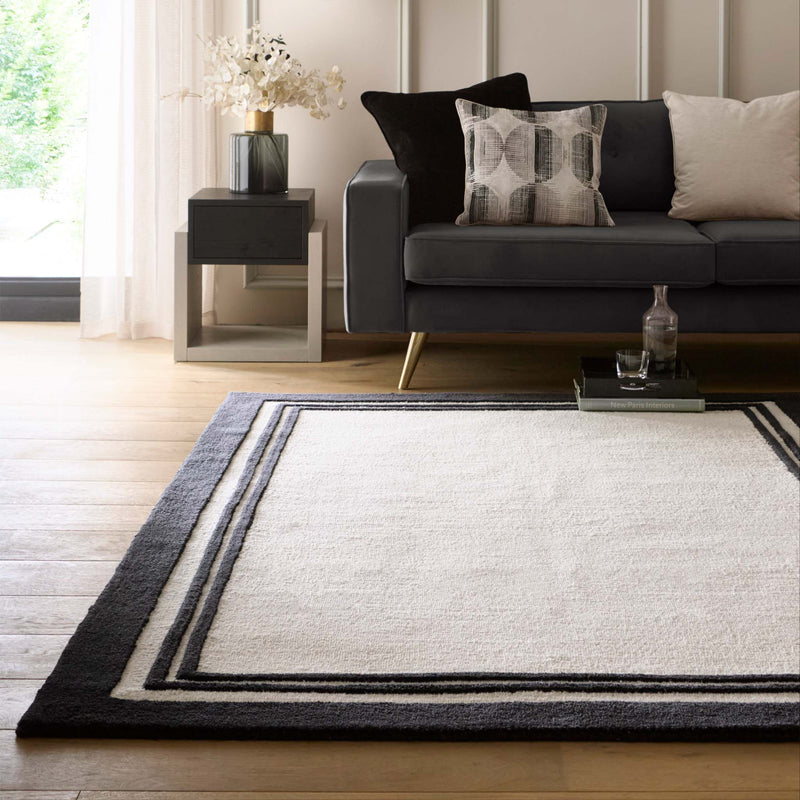 Piper Monochrome Wool Rug with a black two border design.