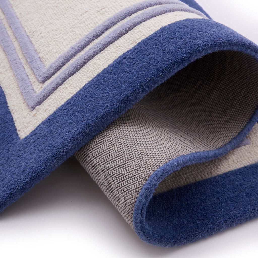 Piper Navy Runner- 100% wool runner featuring a dark and purple border.