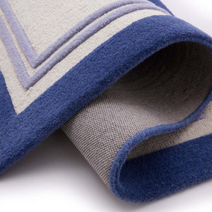 Piper Navy Runner- 100% wool runner featuring a dark and purple border.