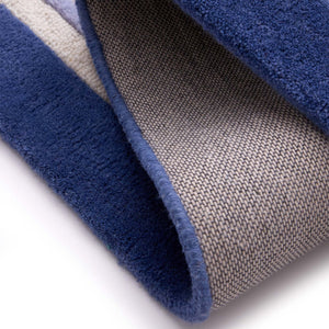 Piper Rug Navy- 100% wool rug with a purple and blue border.