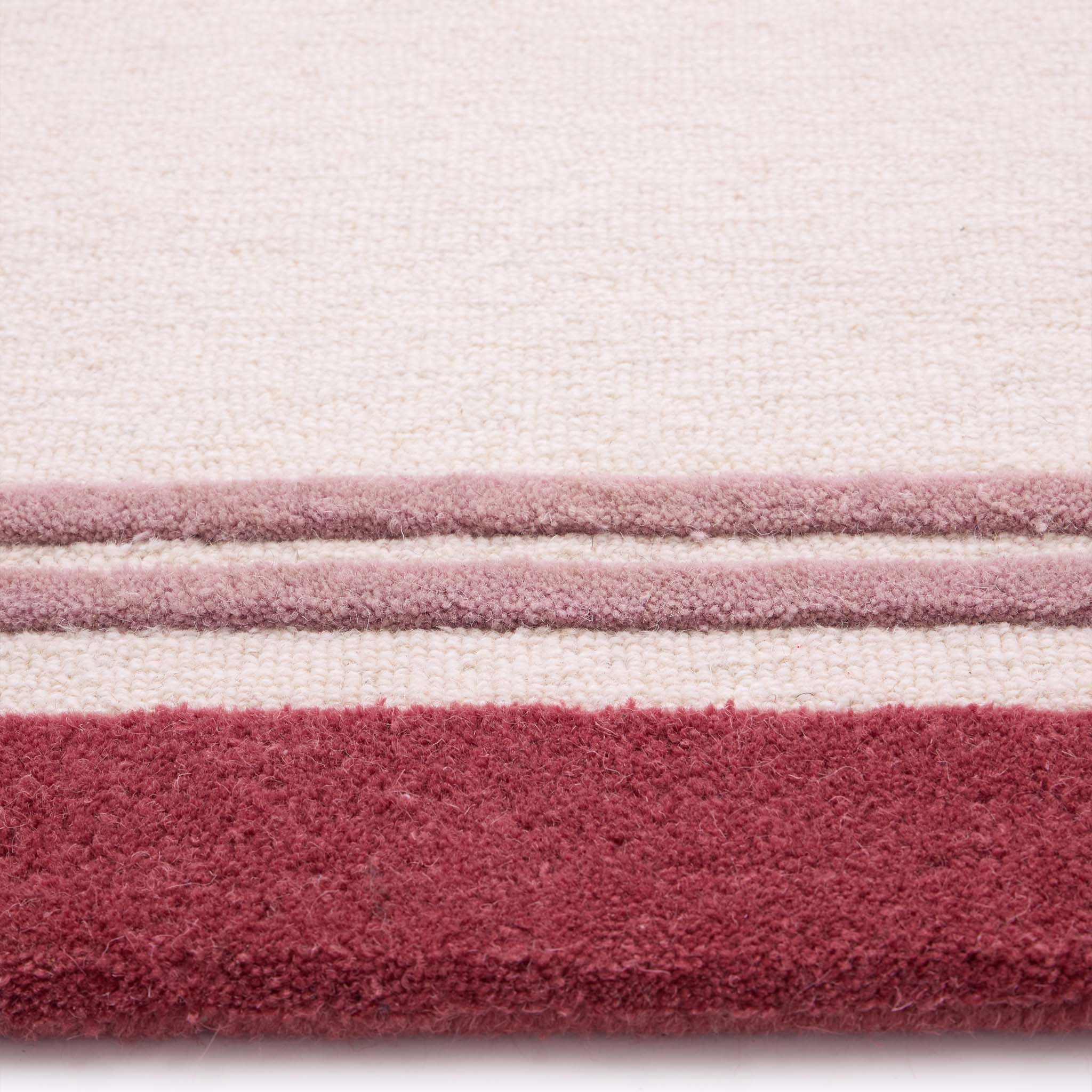Piper Rug Runner Raspberry- a 100% wool runner featuring a pink border.