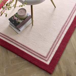 Piper Rug- a 100% wool rug with a raspberry border.  
