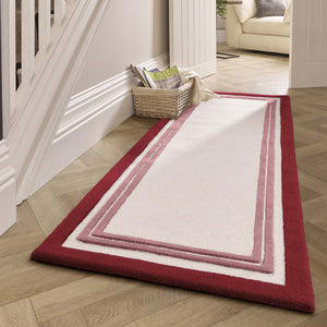 Piper Rug Runner Raspberry- a 100% wool runner featuring a pink border.