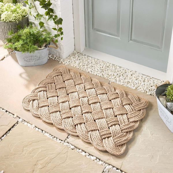 Lovers Knot Outdoor Sand- featuirng a knotted pattern in beige.