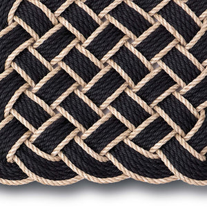 Lovers Knot black outdoor mat- featuring a rope design.